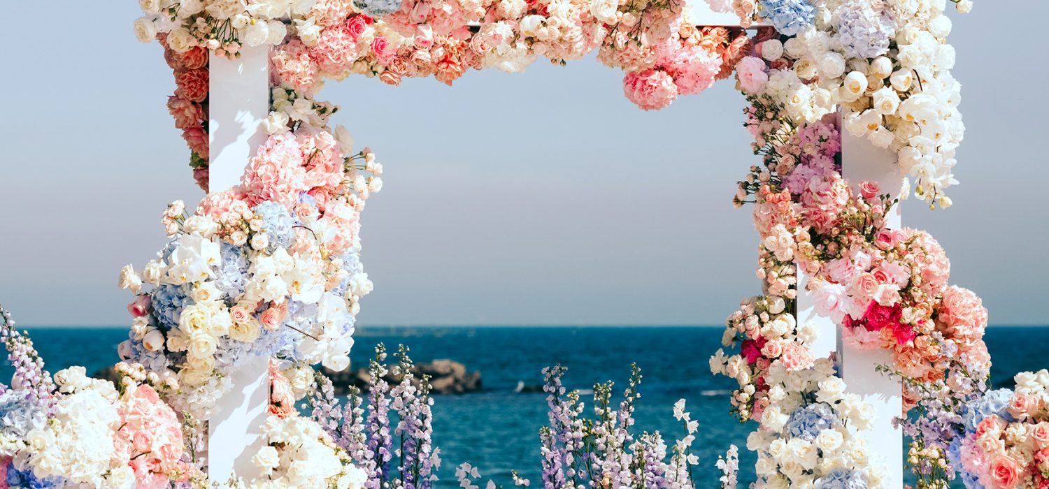 Beautiful decorated wedding arch near the sea